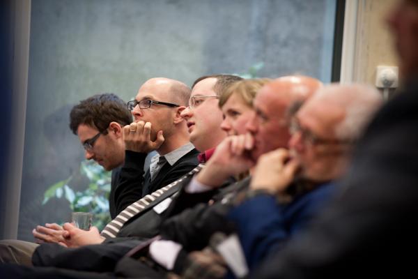 RAI Fellows listening to a speaker