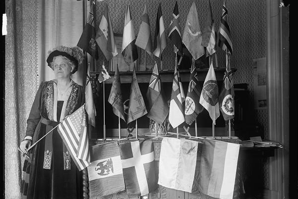 Carrie Chapman Catt with flags of 22 nations
