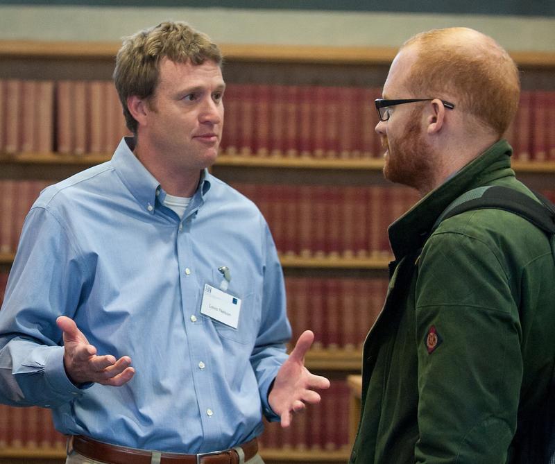 Fellows in residence Two men standing and talking