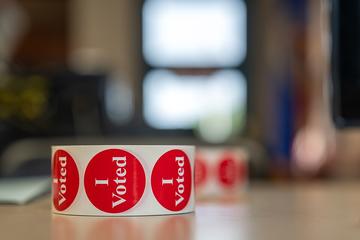 A roll of "I Voted" stickers in Aitkin Public Library Primary Election Day, Aug. 11, 2026 Aitkin, Minnesota  Photo by Lorie Shaul, public domain, via Wikicommons