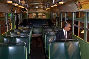 President Barack Obama sits on the famed Rosa Parks bus at the Henry Ford Museum following an event in Dearborn, Mich., April 18, 2012. (Official White House Photo by Pete Souza). As a work of the U.S. federal government, it is in the public domain.